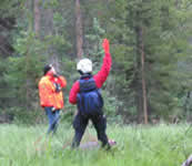 Rescuers looking up to a rescue helicopter